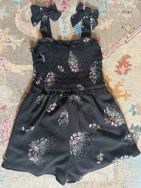 Sheer lined Delicate black Romper with soft floral pattern Size 8